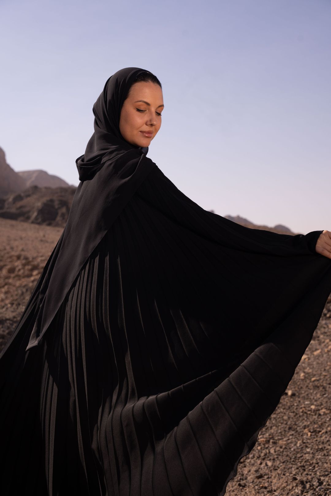 Delia Abaya in Dark Grey