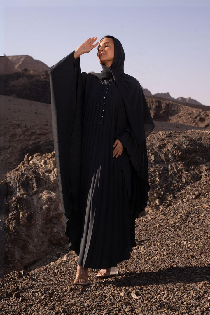 Delia Abaya in Dark Grey